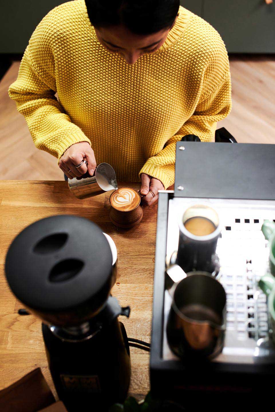 Lifestyle photography of woman making coffee in home by Surrey photographer Del Manning